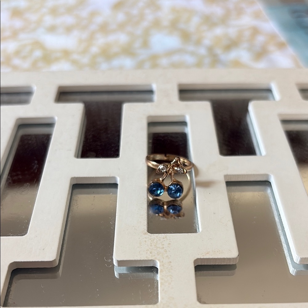 Elegant Gold Ring with Blue Gems